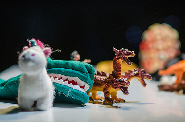 Photo of unicorn cuddly animal, crocodile hand puppet and plastic dragon figurine